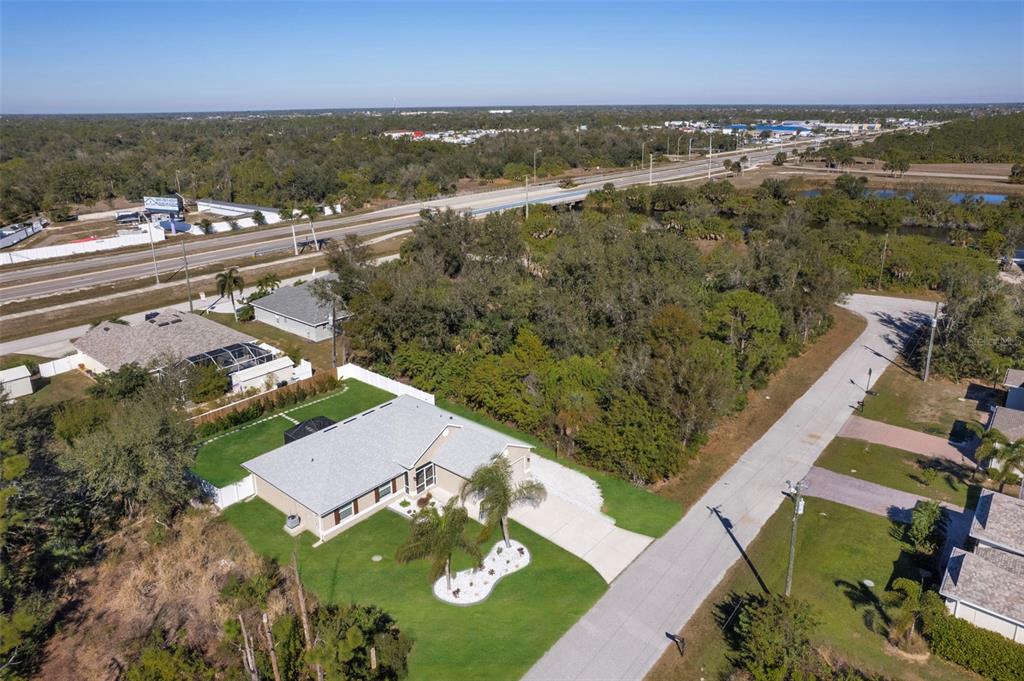 8049 Dimstead Street Port Charlotte, FL 33981 - Photo 35 of 39 an aerial view of residential houses with outdoor space
