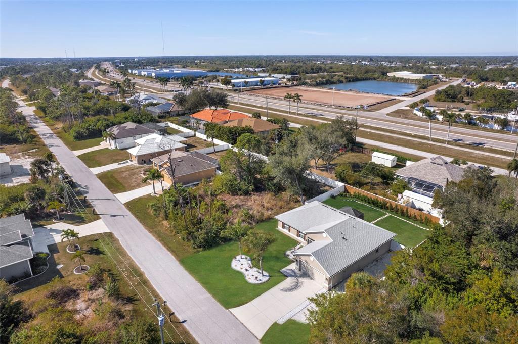 8049 Dimstead Street Port Charlotte, FL 33981 - Photo 36 of 39 an aerial view of residential houses with outdoor space