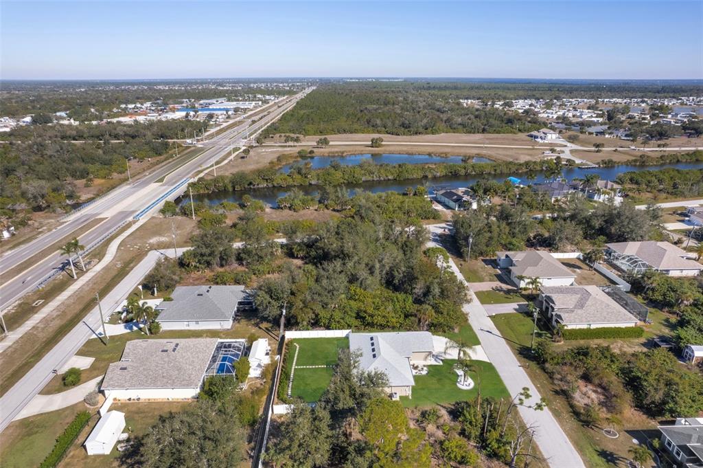 8049 Dimstead Street Port Charlotte, FL 33981 - Photo 38 of 39 an aerial view of residential houses with outdoor space