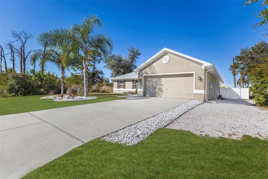 8049 Dimstead Street Port Charlotte, FL 33981 - Photo 39 of 39 a front view of a house with a yard