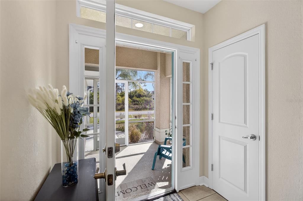 8049 Dimstead Street Port Charlotte, FL 33981 - Photo 4 of 39 a living room with furniture and a potted plant