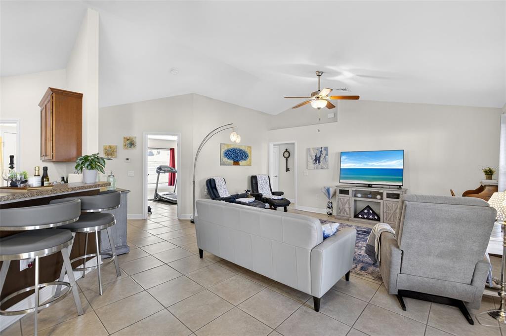 8049 Dimstead Street Port Charlotte, FL 33981 - Photo 7 of 39 a living room with furniture and a flat screen tv