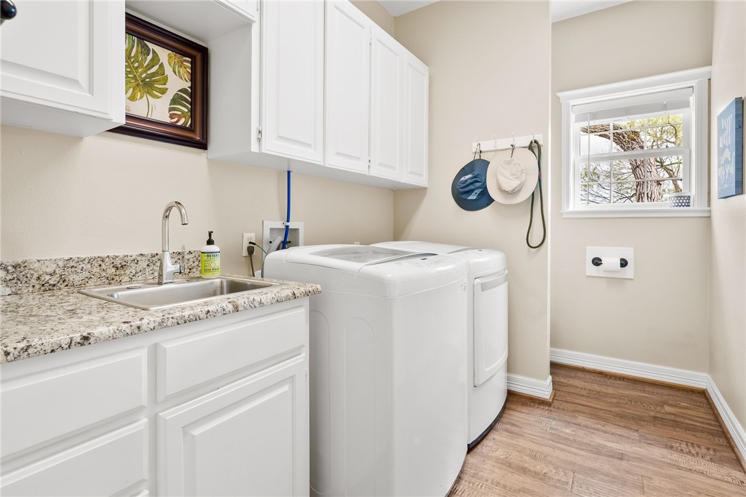 2 Schendel Road Portland, TX 78374 - Photo 20 of 39 a utility room with sink dryer and washer