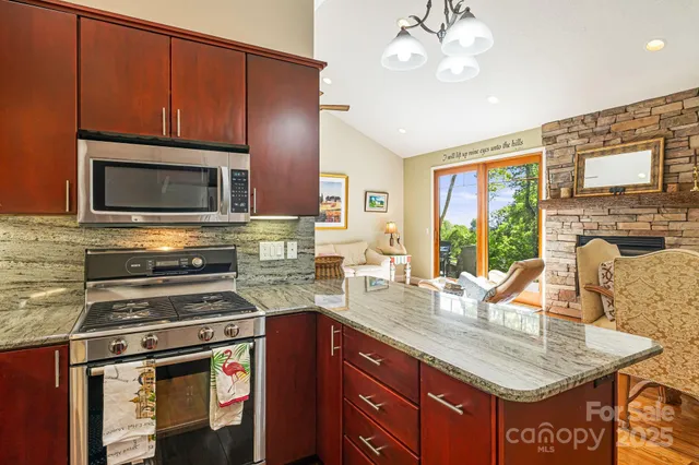 a kitchen with a stove a sink and a microwave
