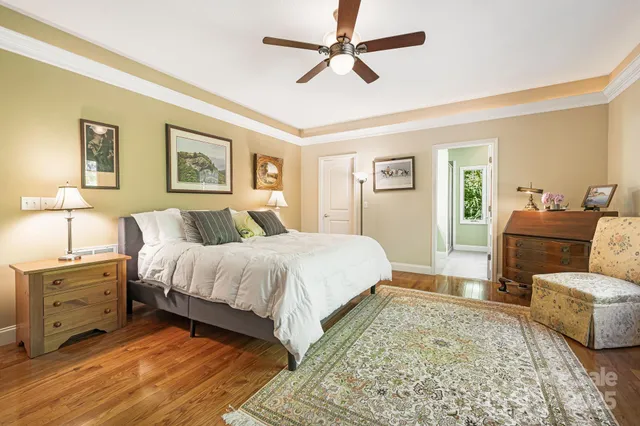 a spacious bedroom with a bed and furniture