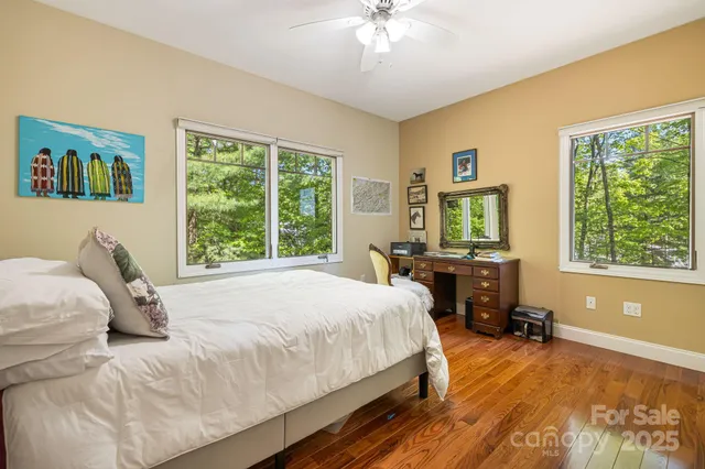 a bedroom with a bed and a table