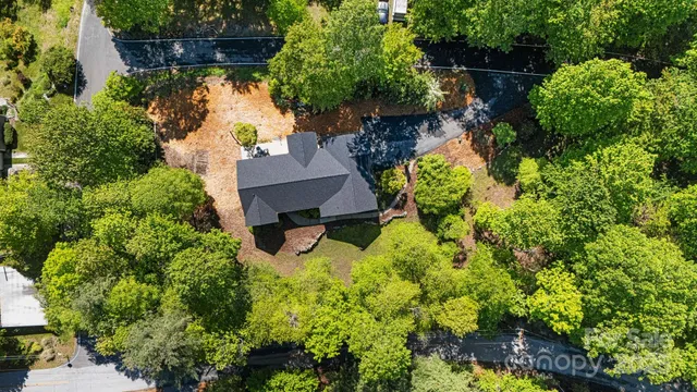 an aerial view of a house with swimming pool