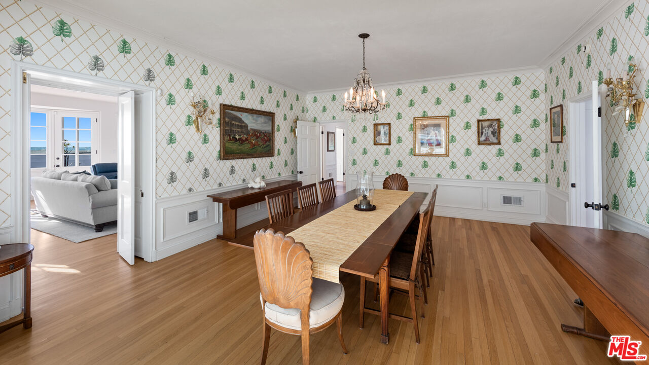 605 Palisades Beach Road Santa Monica, CA 90402 - Photo 8 of 33 a view of a dining room with furniture and wooden floor