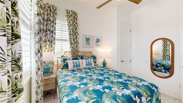 a bedroom with a bed and a painting on the wall