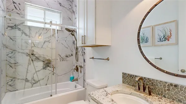 a bathroom with a bathtub and a shower