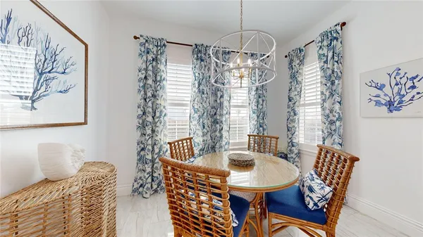 a dining room with furniture and window
