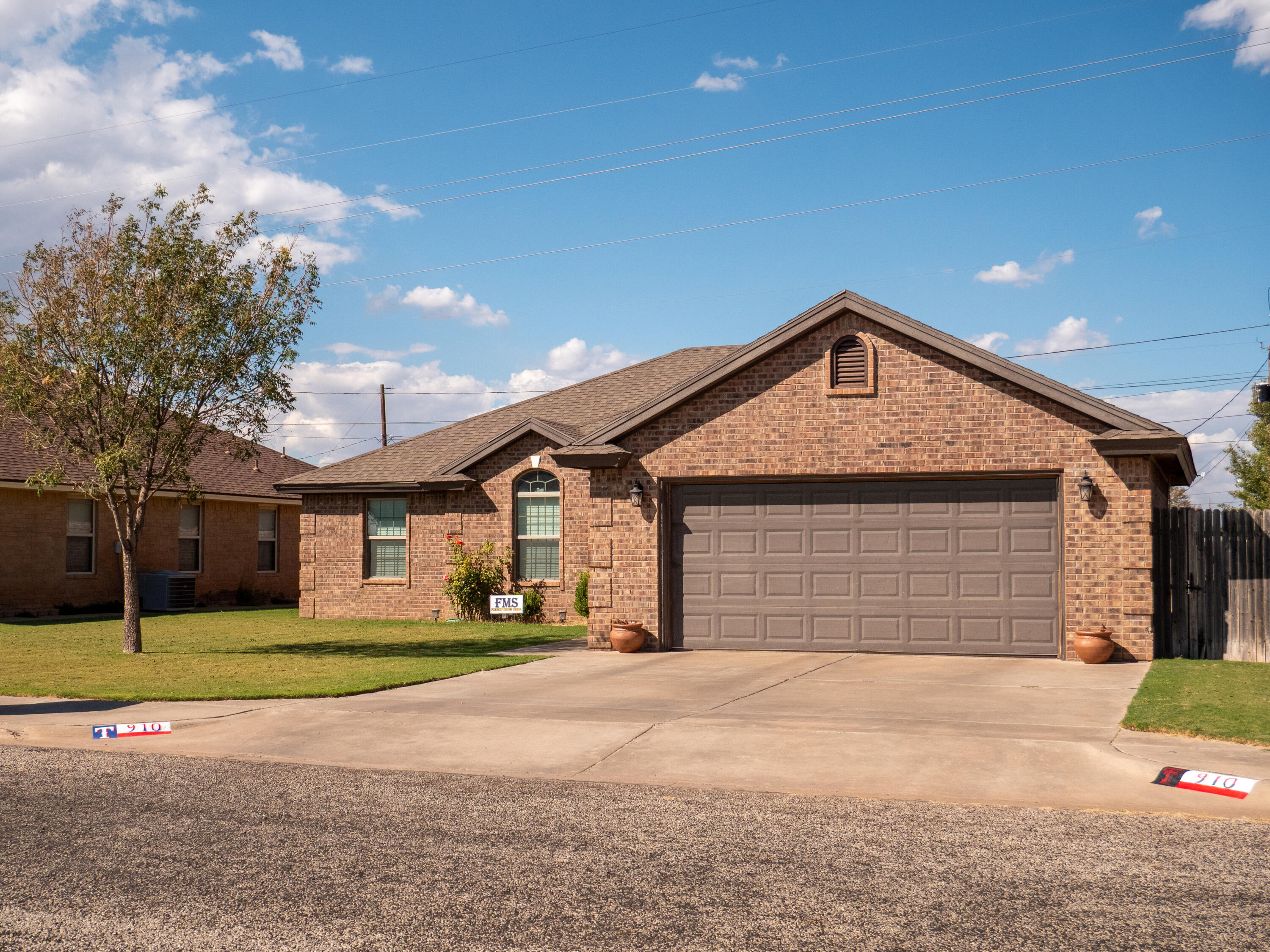 910 12th Street Wolfforth, TX 79382 - Photo 18 of 18 a front view of a house with a yard and garage
