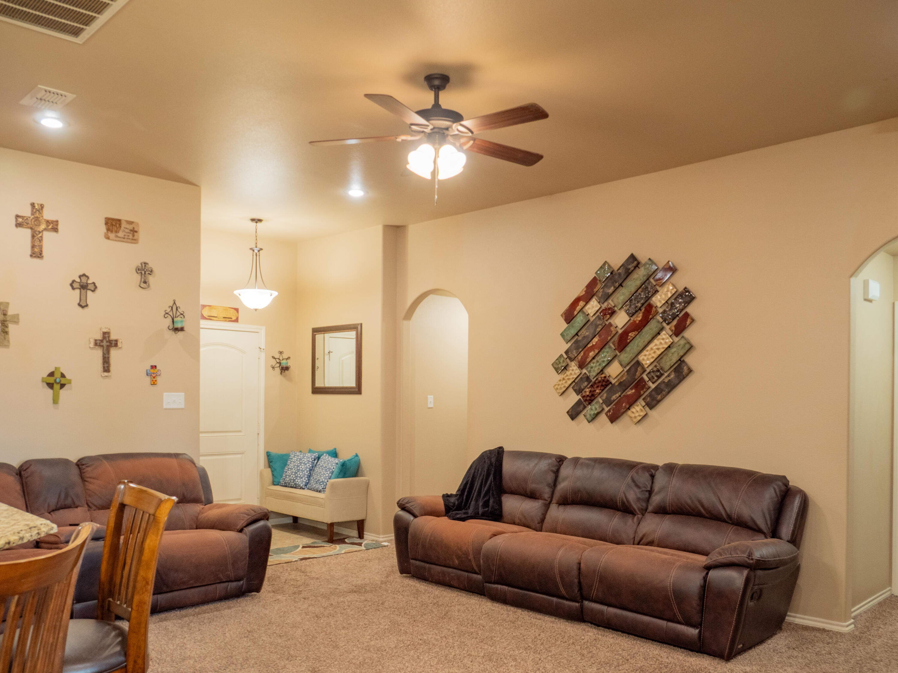 910 12th Street Wolfforth, TX 79382 - Photo 3 of 18 a living room with furniture and a ceiling fan