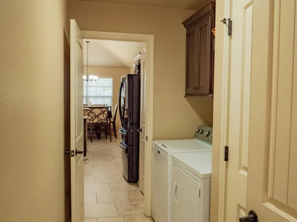 a utility room with closet dryer and washer