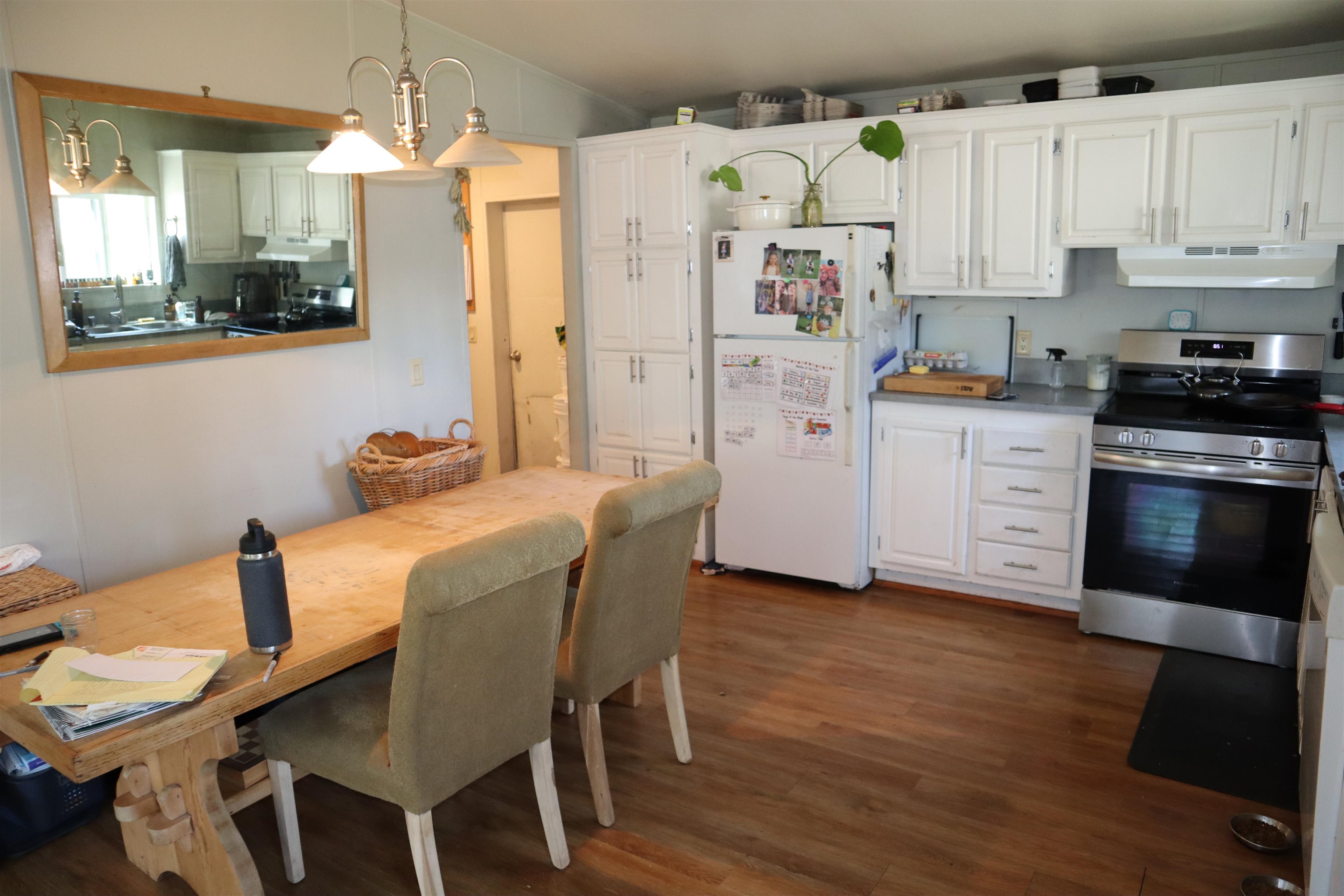 193 Fairground Road Quincy, CA 95971 - Photo 4 of 20 a kitchen with stainless steel appliances granite countertop a kitchen island hardwood floor and a sink