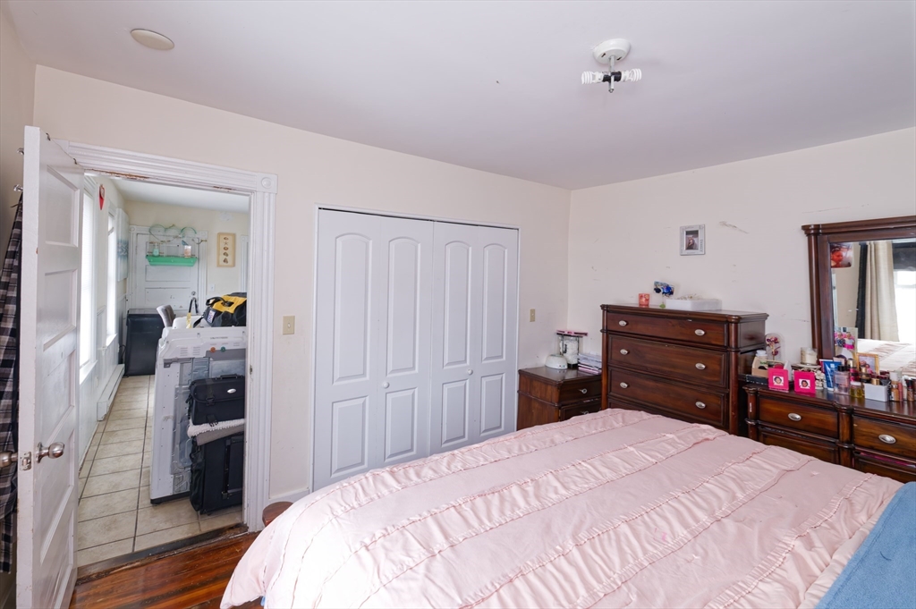 10 Rhubena Street Framingham, MA 01702 - Photo 14 of 30 a bedroom with a bed and a mirror