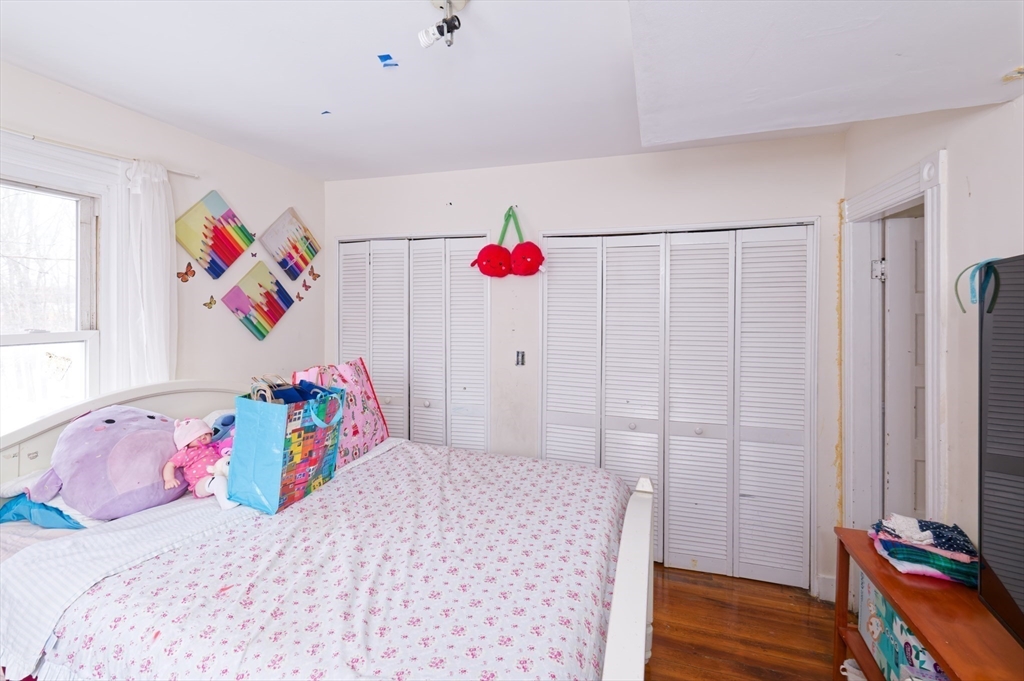 10 Rhubena Street Framingham, MA 01702 - Photo 15 of 30 a bedroom with a bed and a window