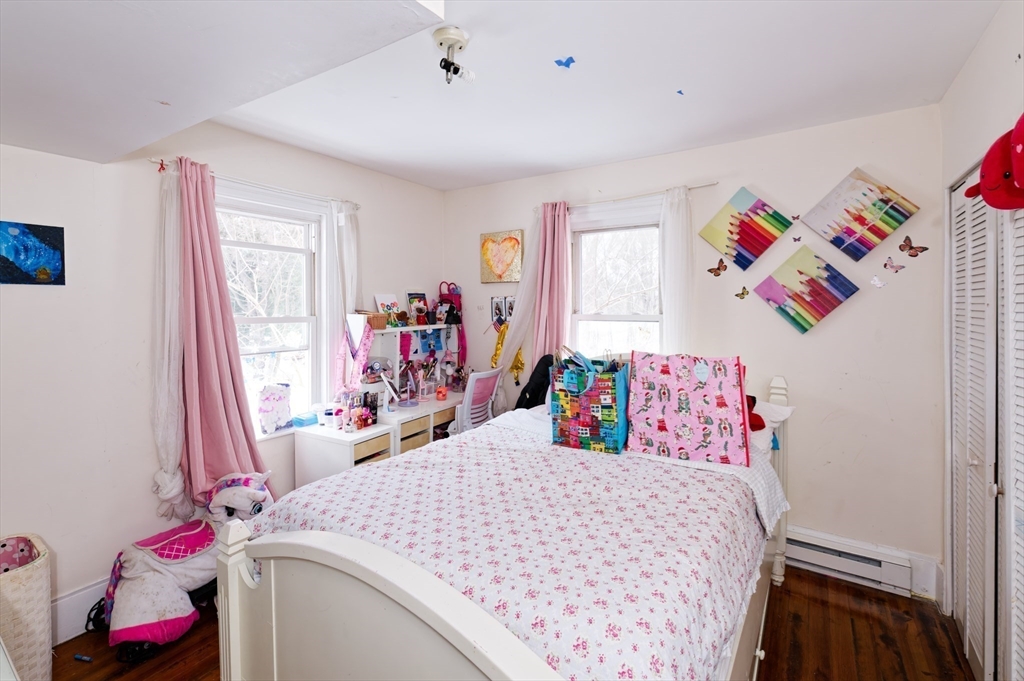 10 Rhubena Street Framingham, MA 01702 - Photo 16 of 30 a bed room with a bed and a window