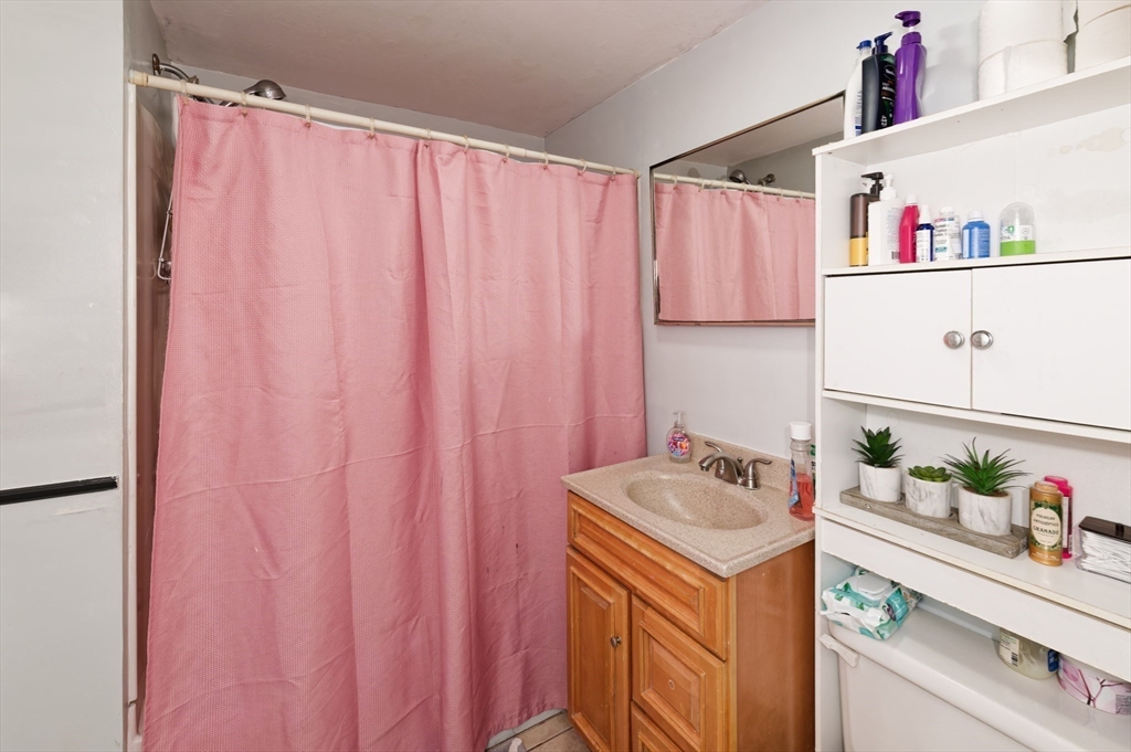 10 Rhubena Street Framingham, MA 01702 - Photo 18 of 30 a utility room with a sink and cabinets