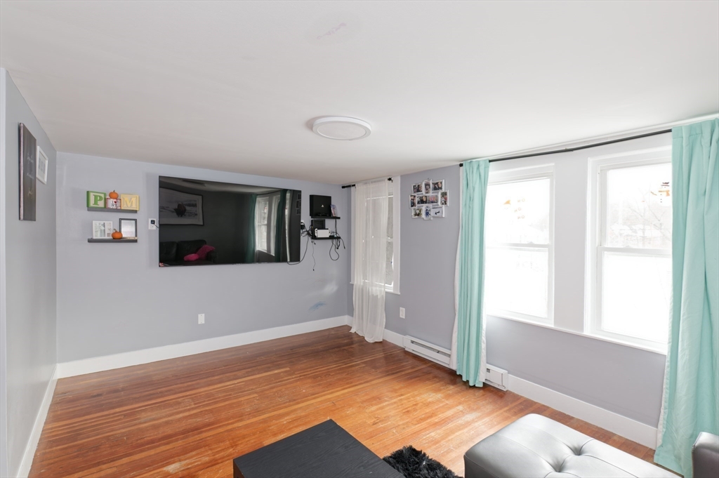 10 Rhubena Street Framingham, MA 01702 - Photo 19 of 30 a view of empty room with wooden floor and fan
