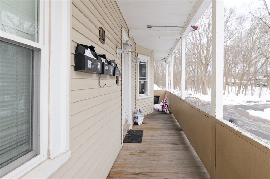 10 Rhubena Street Framingham, MA 01702 - Photo 2 of 30 a view of a balcony with wooden floor