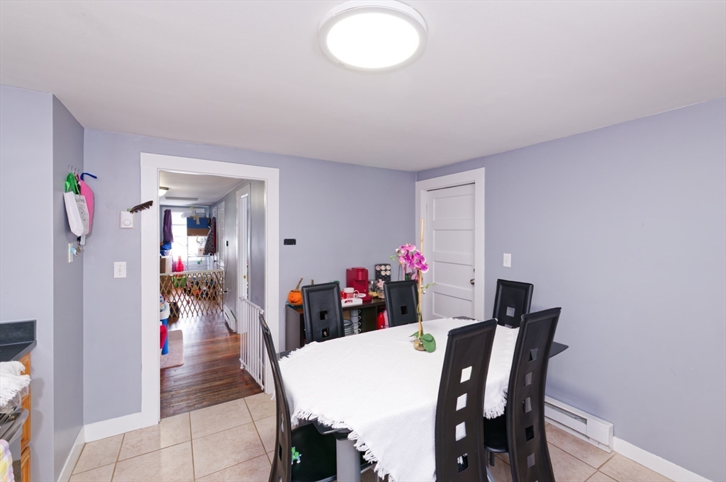 10 Rhubena Street Framingham, MA 01702 - Photo 21 of 30 a view of a dining room with furniture and wooden floor