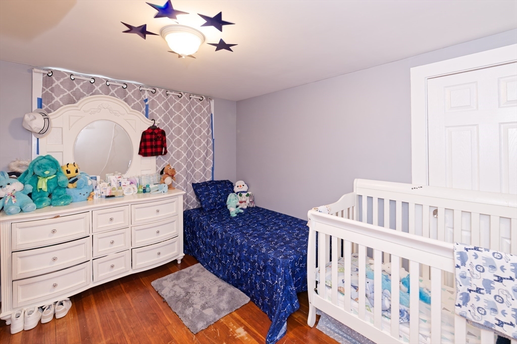 10 Rhubena Street Framingham, MA 01702 - Photo 24 of 30 a living room with furniture and wooden floor