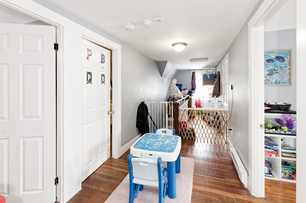 10 Rhubena Street Framingham, MA 01702 - Photo 25 of 30 a view of a hallway with furniture and wooden floor