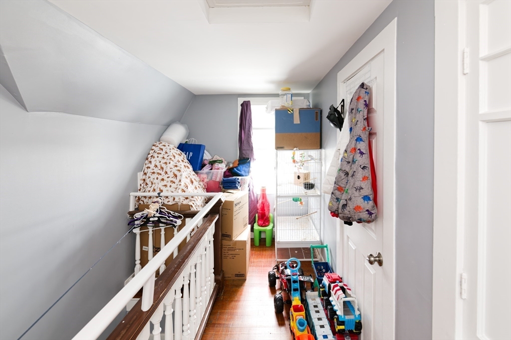 10 Rhubena Street Framingham, MA 01702 - Photo 27 of 30 a view of a hallway with lots of stuff and white painted walls