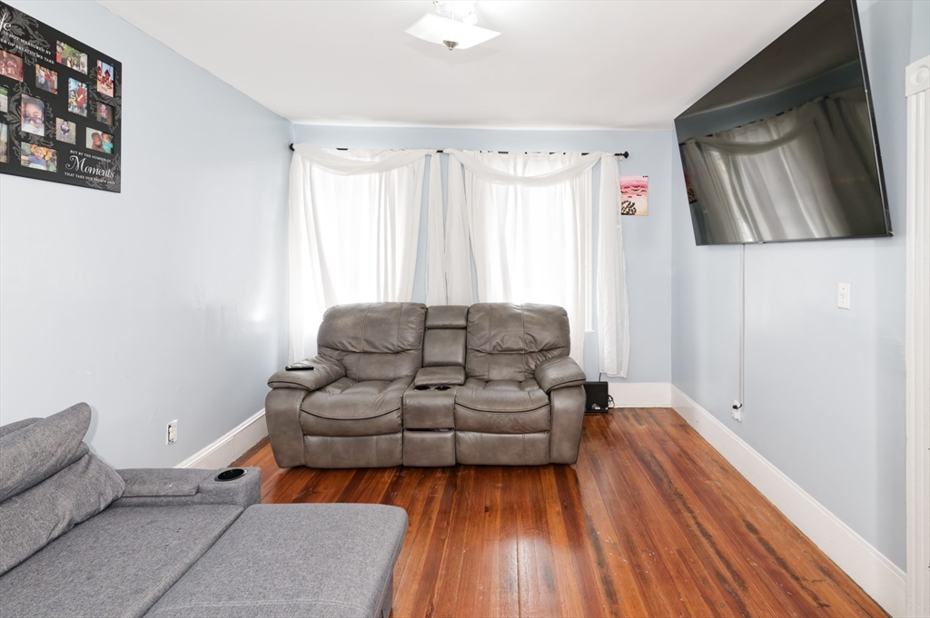 10 Rhubena Street Framingham, MA 01702 - Photo 3 of 30 a living room with furniture and a wooden floor