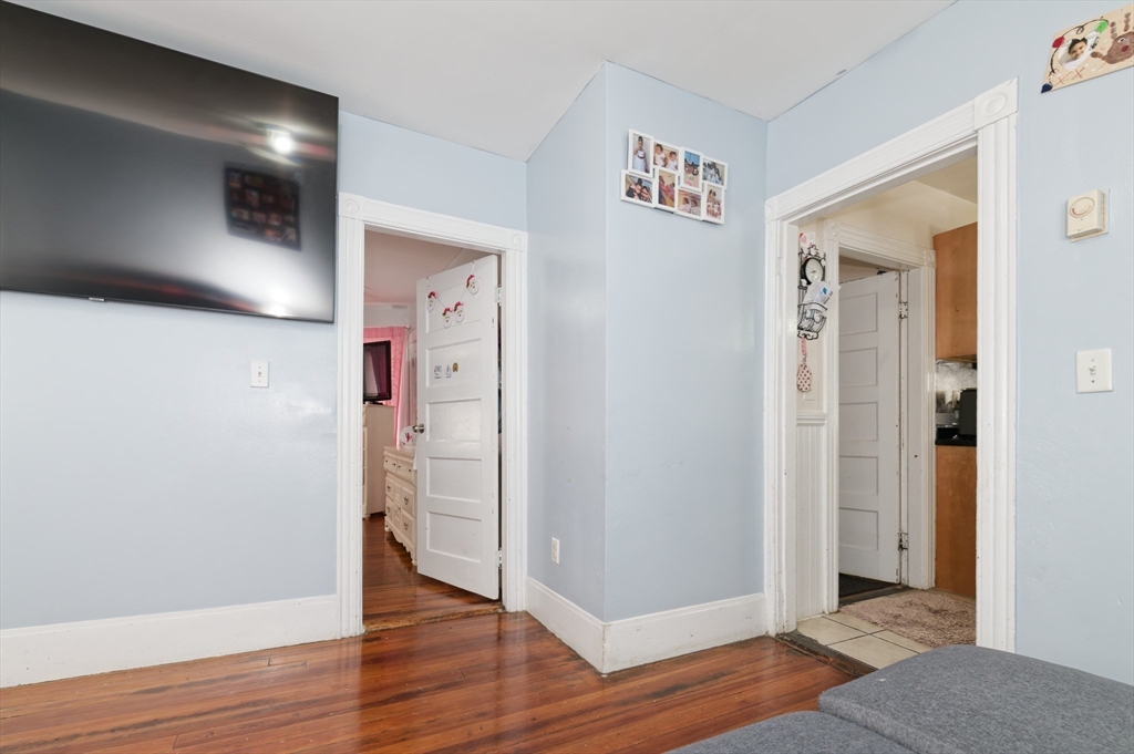 10 Rhubena Street Framingham, MA 01702 - Photo 5 of 30 a view of a hallway with wooden floor