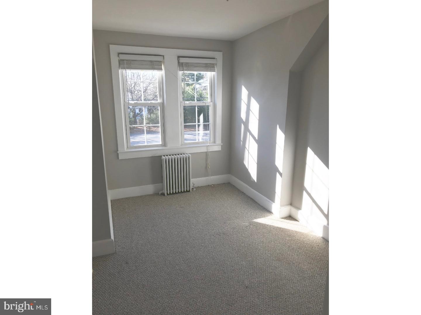 902 Hughes Drive, Unit 2 Hamilton, NJ 08690 - Photo 4 of 9 a view of an empty room with a window