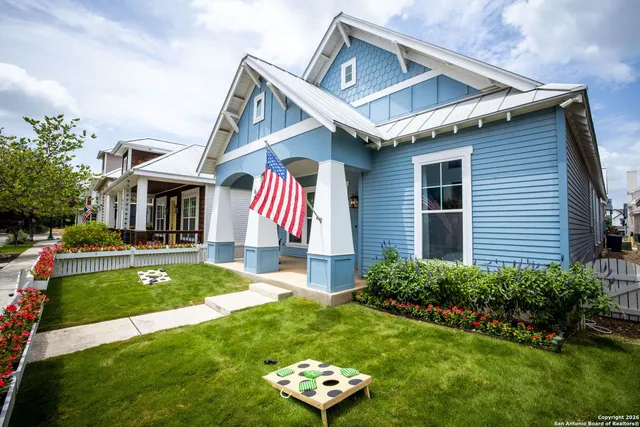 a front view of house with yard and outdoor seating