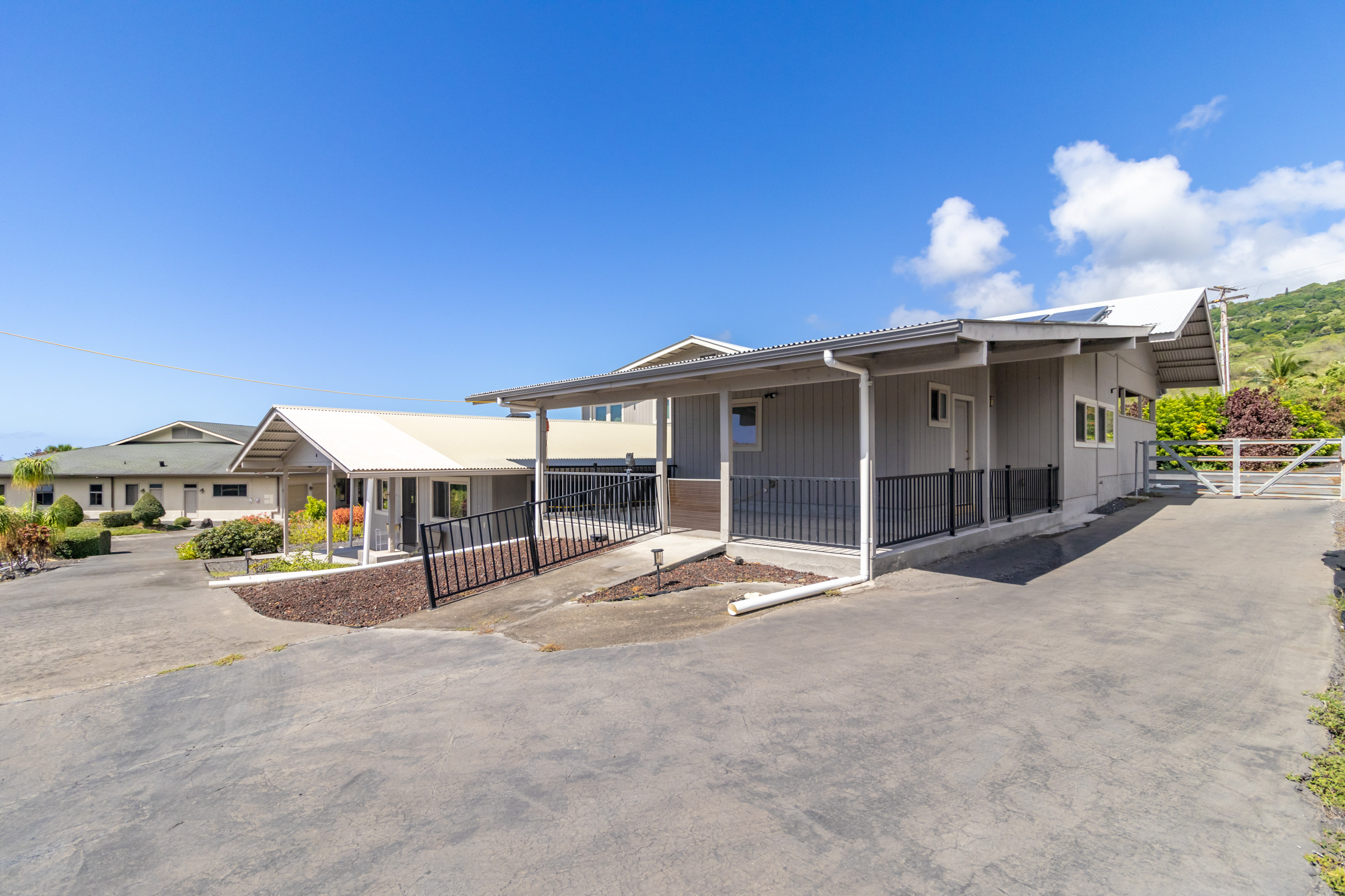 82-1097 Meli Road Captain Cook, HI 96704 - Photo 4 of 23 a view of a house with backyard and porch