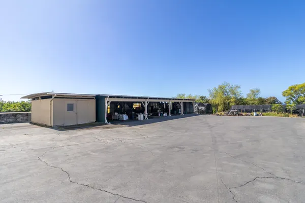 a view of a couches under an umbrella