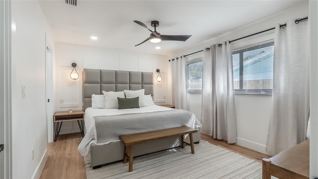 1399 West Camino Real Boca Raton, FL 33486 - Photo 13 of 45 a bedroom with a bed and a ceiling fan