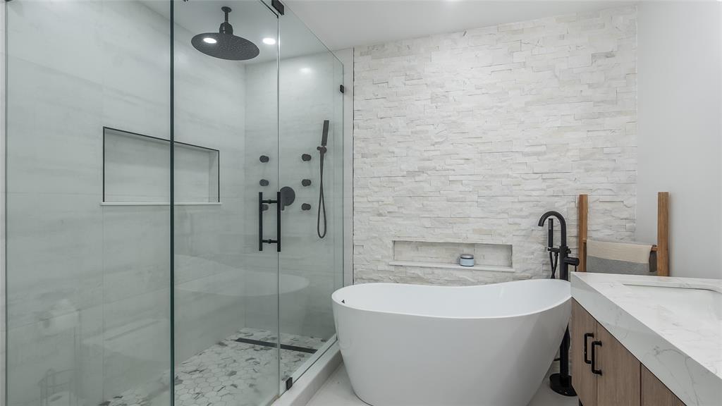 1399 West Camino Real Boca Raton, FL 33486 - Photo 16 of 45 a bathroom with a sink a toilet and shower