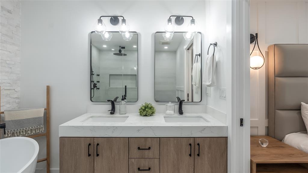 1399 West Camino Real Boca Raton, FL 33486 - Photo 17 of 45 a bathroom with a sink and a mirror