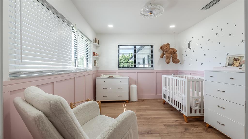 1399 West Camino Real Boca Raton, FL 33486 - Photo 19 of 45 a bedroom with furniture and a window