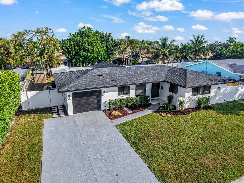 1399 West Camino Real Boca Raton, FL 33486 - Photo 39 of 45 a aerial view of a house with a yard plants and large tree