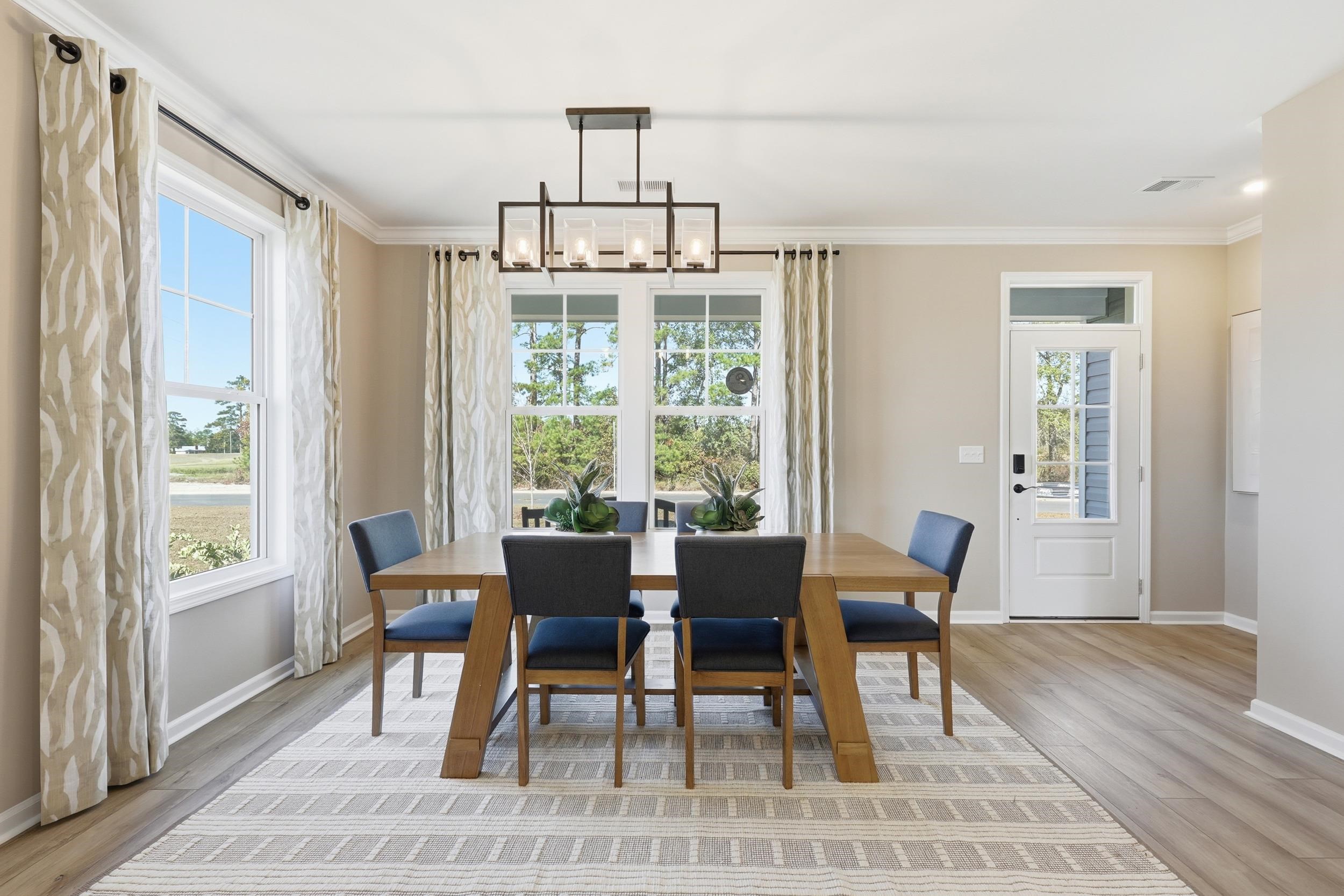 162 Westfield Circle Conway, SC 29526 - Photo 14 of 31 Dining room featuring a chandelier, light wood-style floors, and crown molding