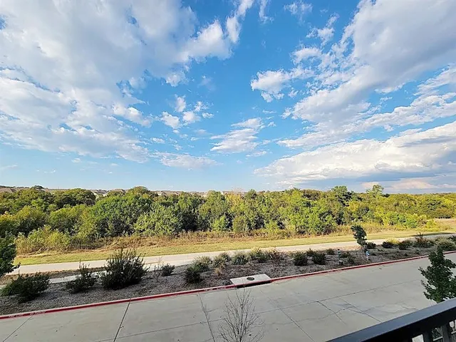 a view of a balcony with city view