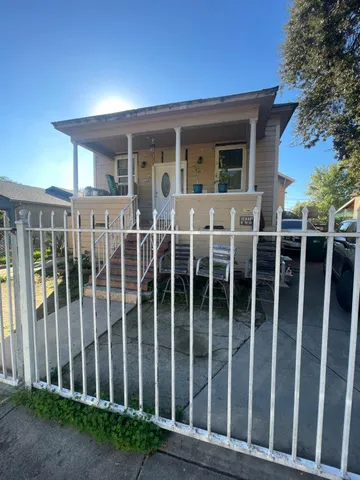 a view of a brick house with a large window