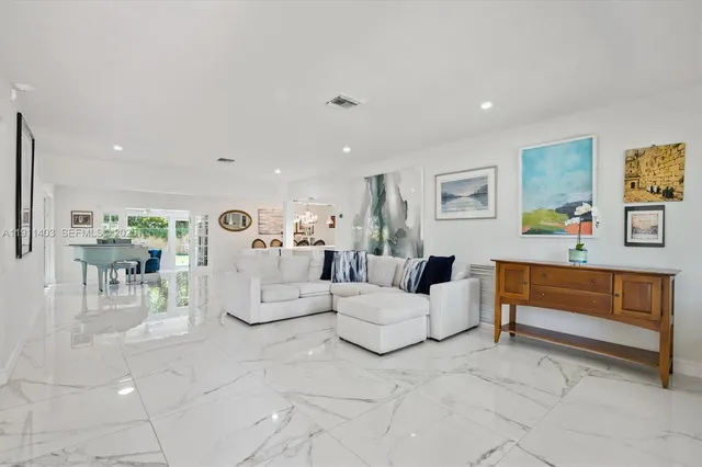 a living room with furniture and a table