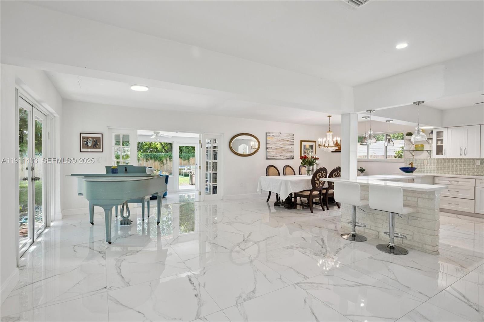 630 Northeast 175th Street Miami, FL 33162 - Photo 5 of 28 a living room with furniture and a table