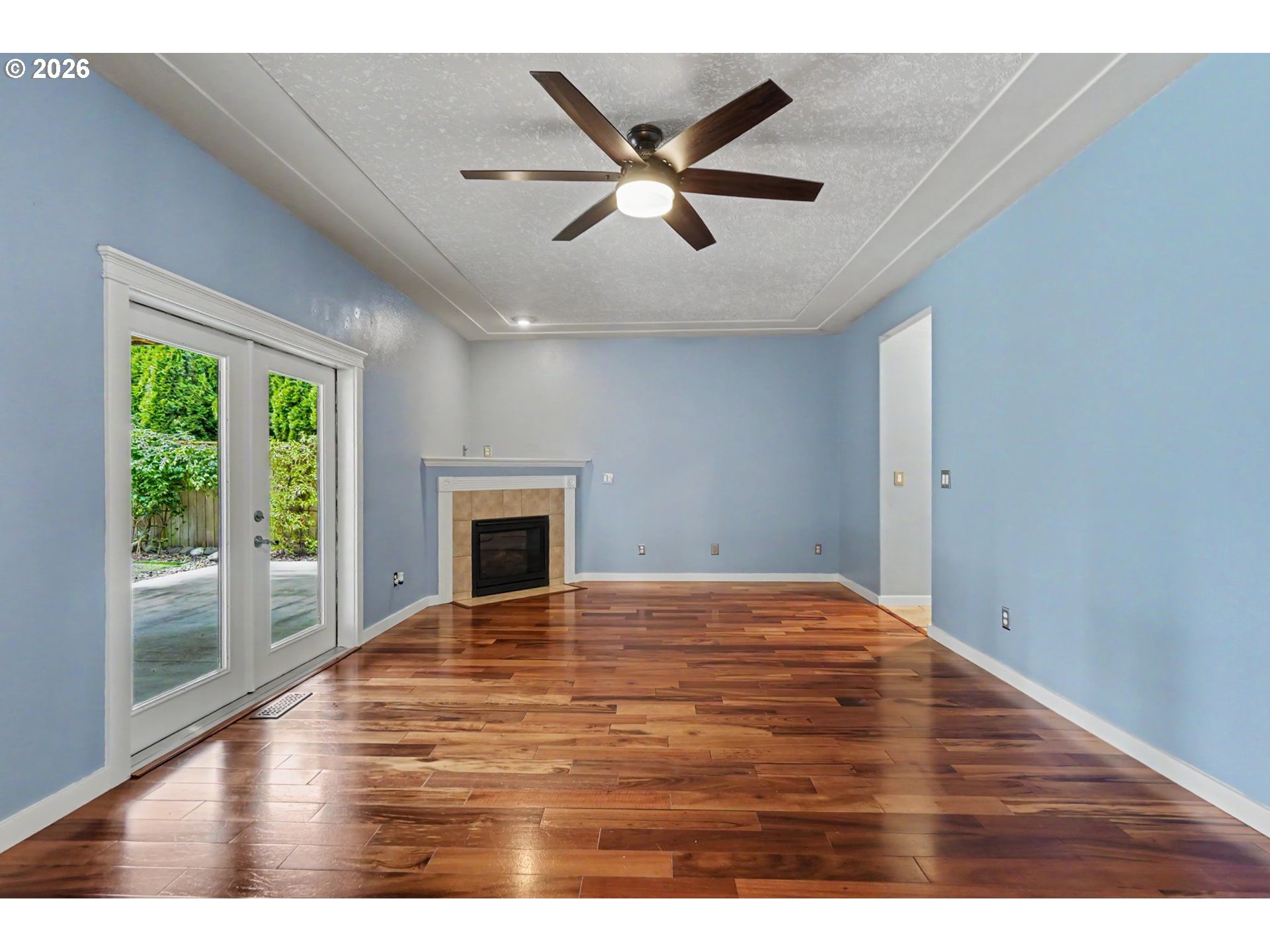 1462 Barnick Road Northeast Keizer, OR 97303 - Photo 10 of 48 a view of empty room with wooden floor and fan