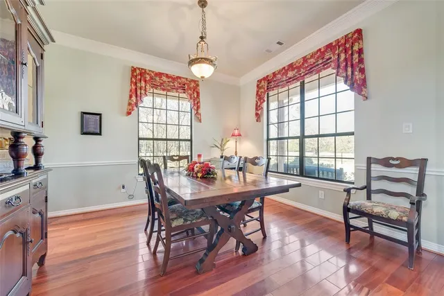 a view of a dining room with furniture and window