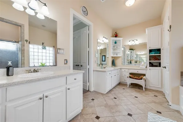 a bathroom with a sink a vanity and a mirror