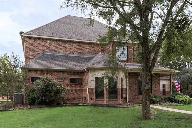 a view of a park with large trees