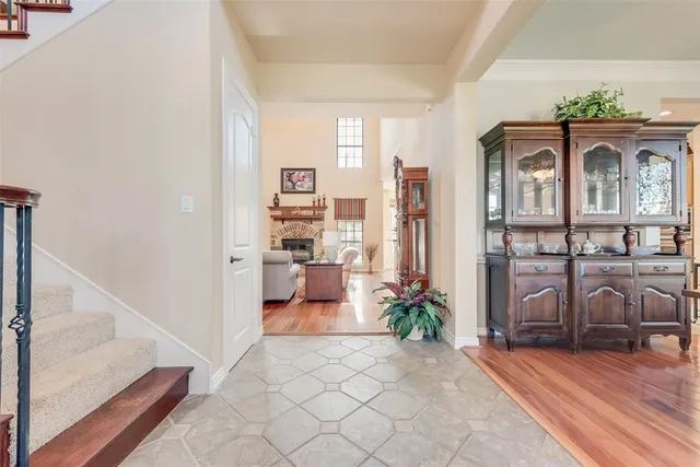 a view of entryway with wooden floor and stairs